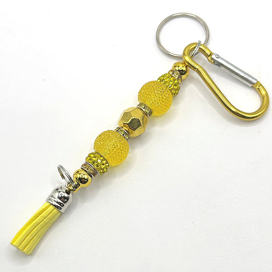 Keyring with Yellow Sparkles and Golden Center