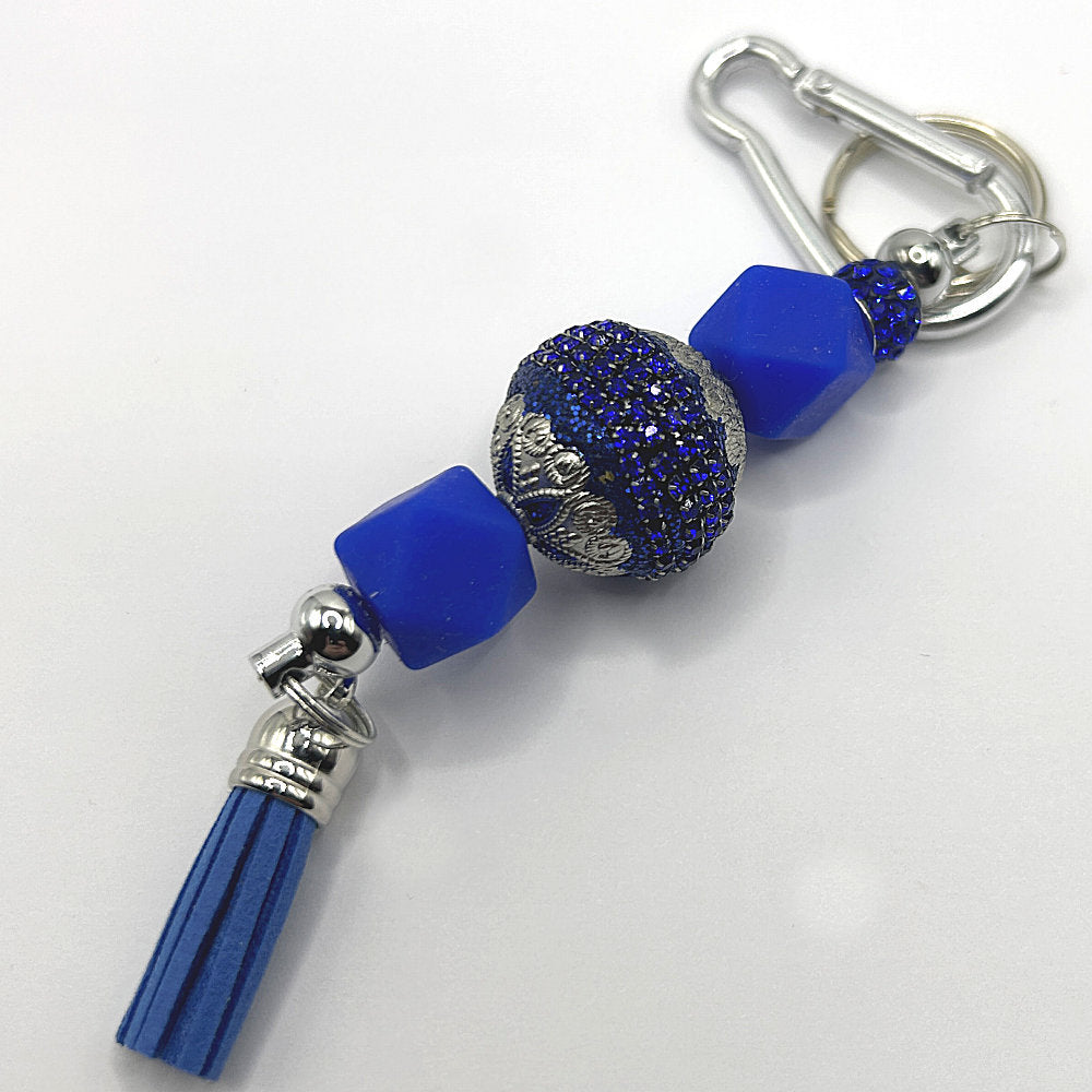Keyring with Ornate Blue Bead, Silicone Accents, and Sparkles